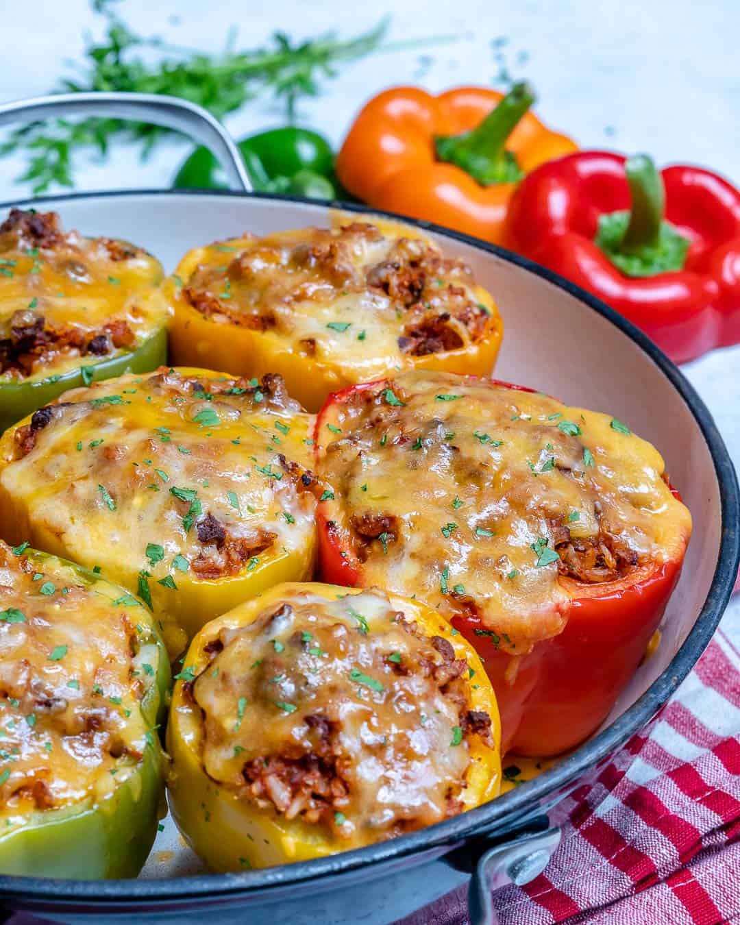 classic stuffed peppers in pan with cheese and parsley 