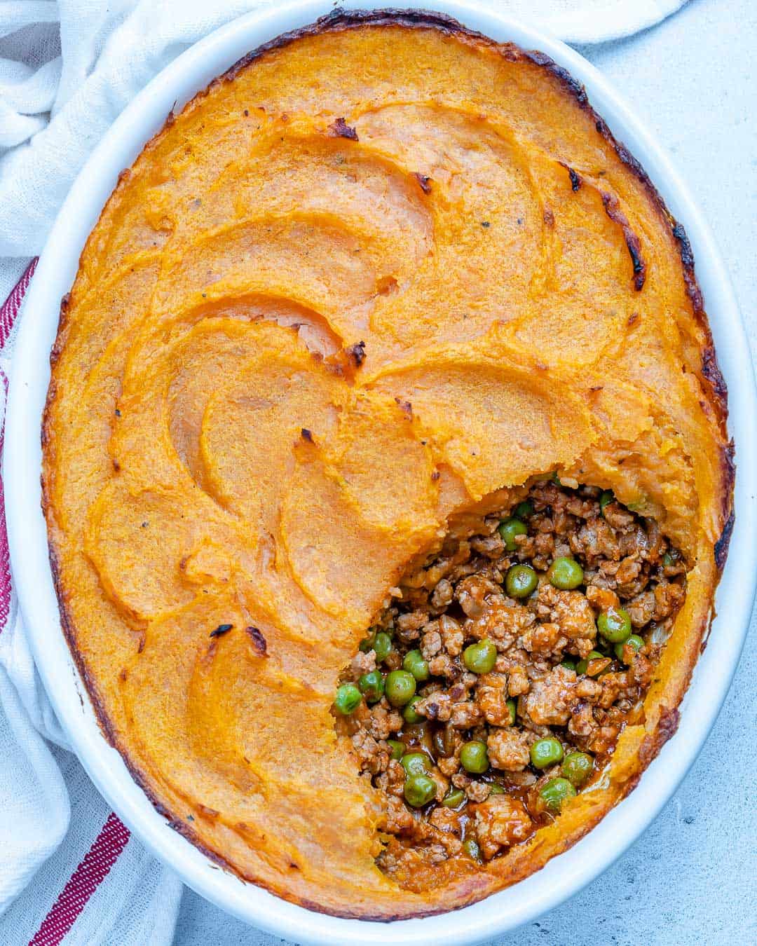 top view of an oval dish with a Healthy sweet potato shepherd's pie