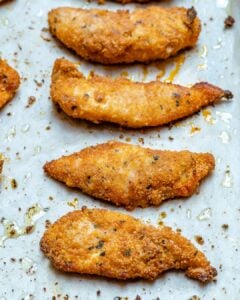 4 baked chicken tenders on a sheet pan