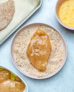 Marinated chicken breast added over bread crumbs.