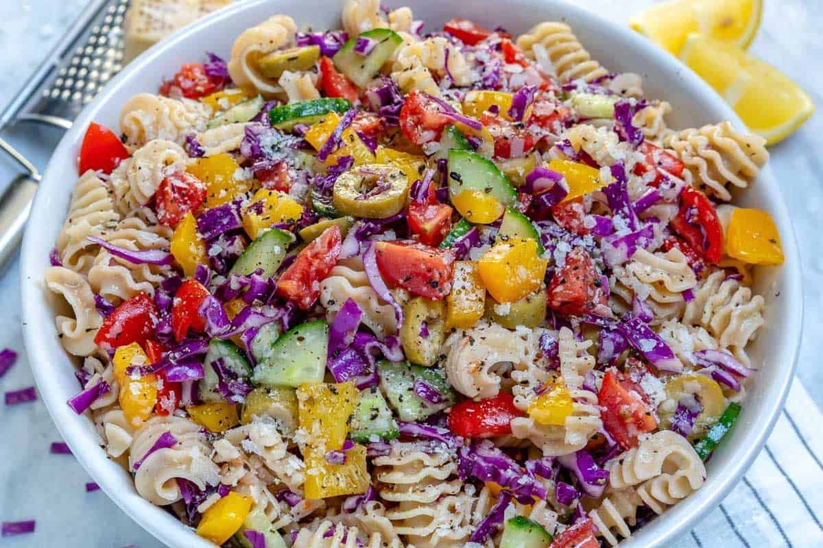 a bowl of pasta salad loaded with veggies.