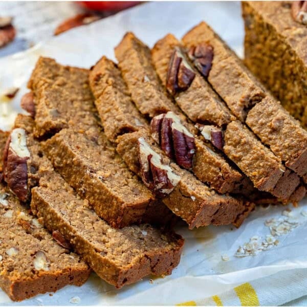 sliced apple pecan cinnamon bread on parchment paper.