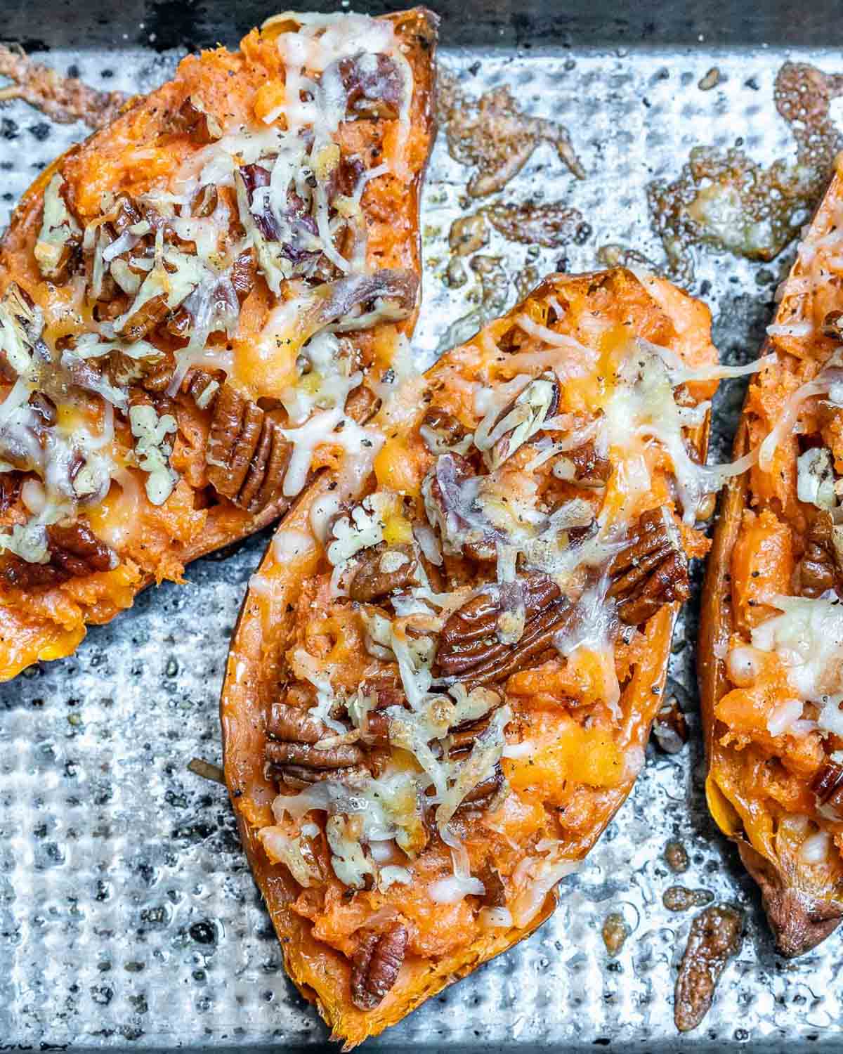 stuffed sweet potato halves on a pan.