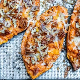 stuffed baked sweet potatoes with cheese and pecans.