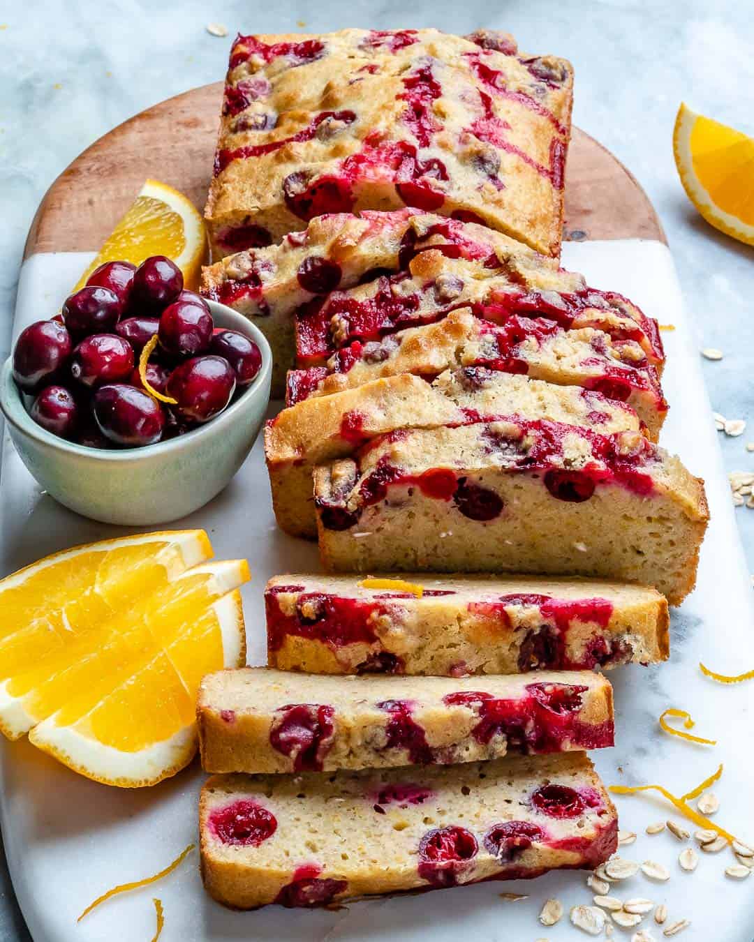 sliced Cranberry Orange Bread on a wooden board