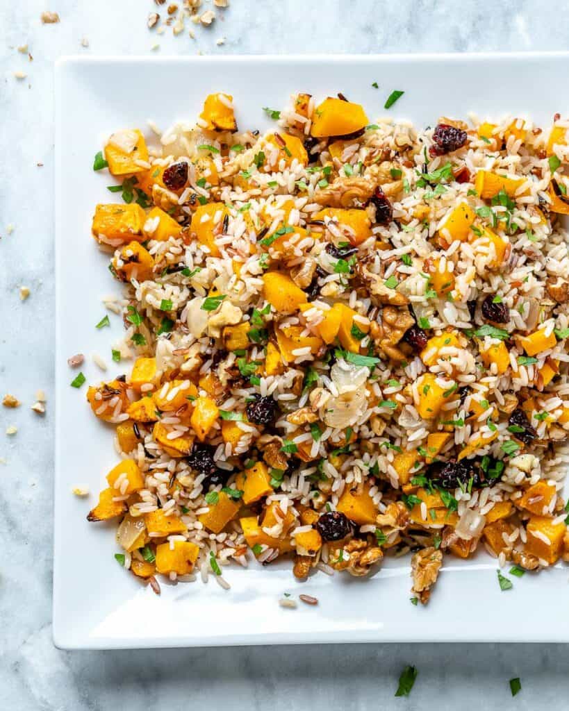 stuffing made with wild rice, butternut squash, cranberries, walnuts, on a plate 