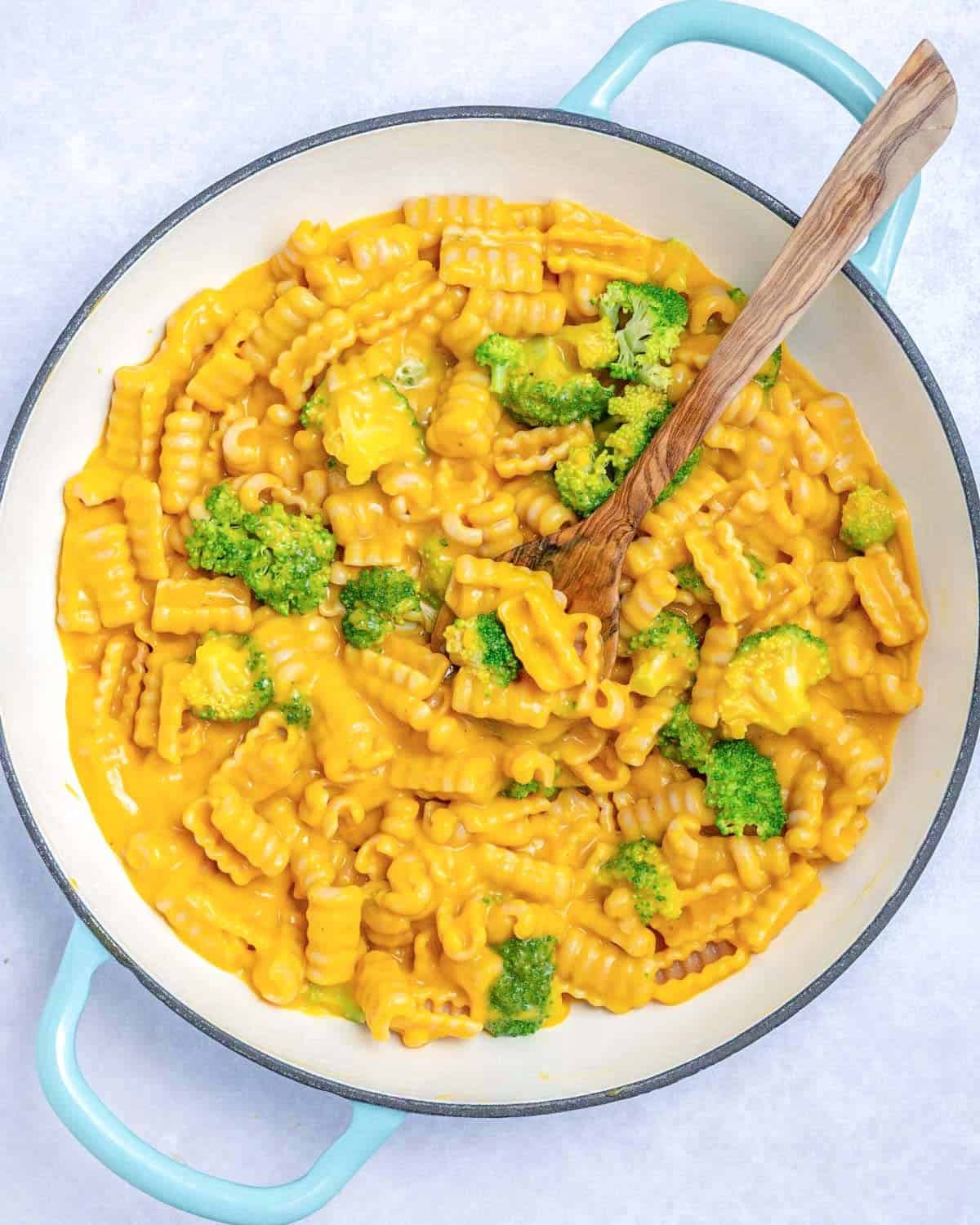  a pan with vegan mac and cheese and broccoli.