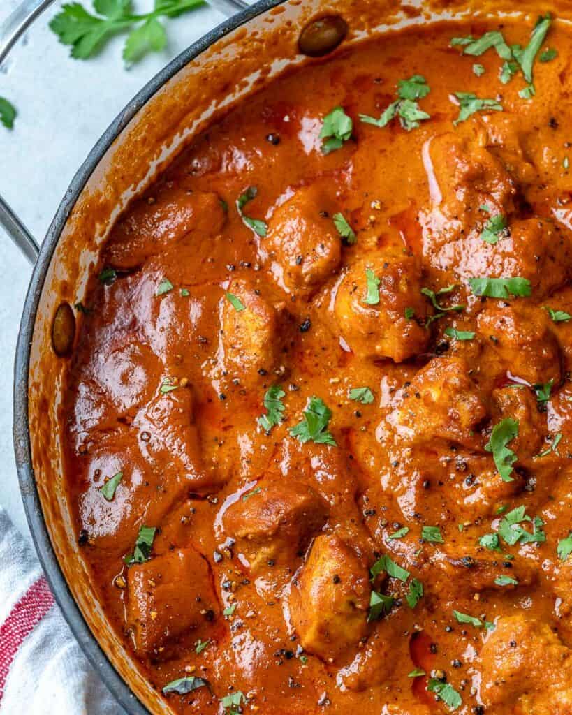 top view of healthy Indian butter chicken recipe in a pan 