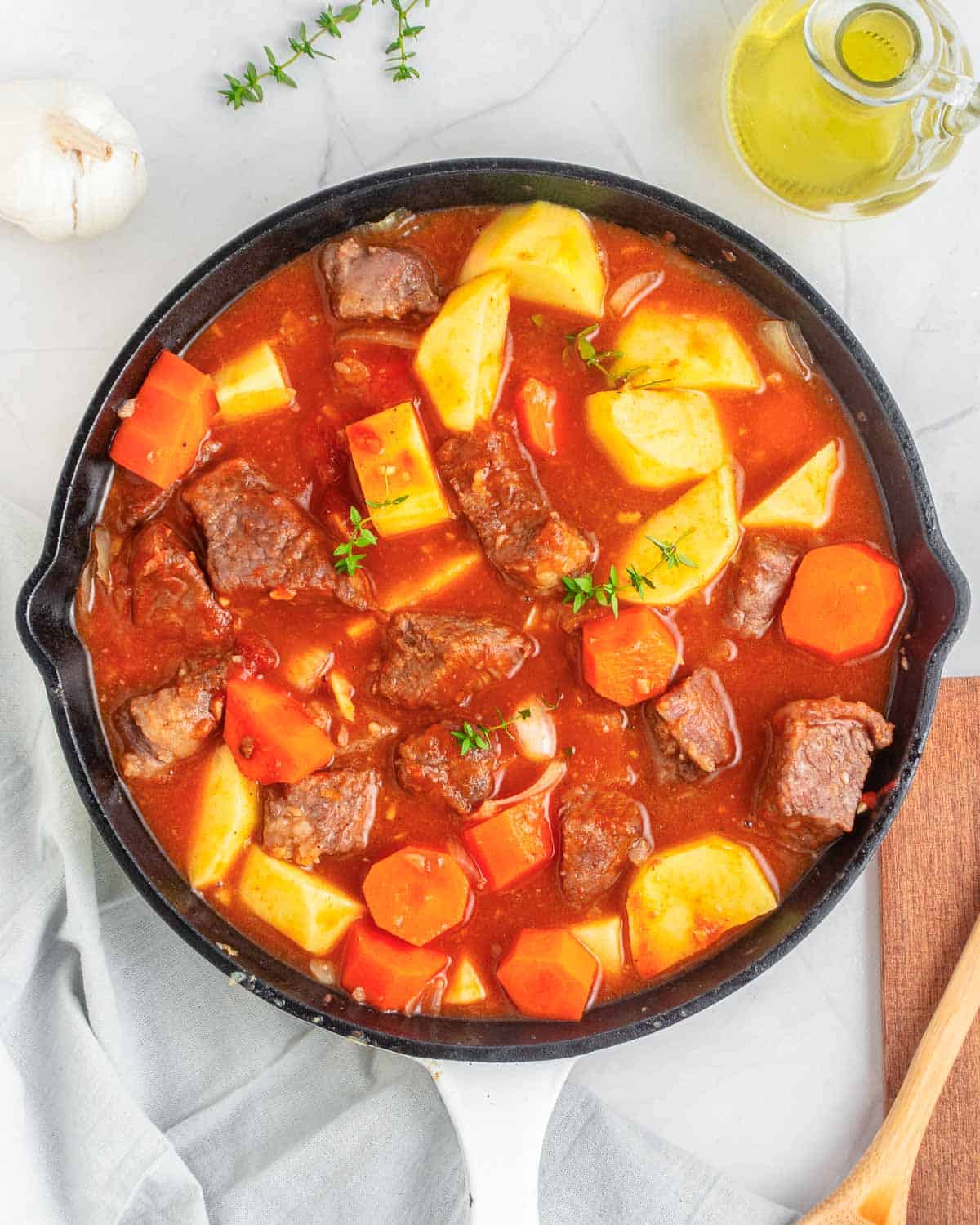 broth and tomato paste added in with beef and veggies to cook.