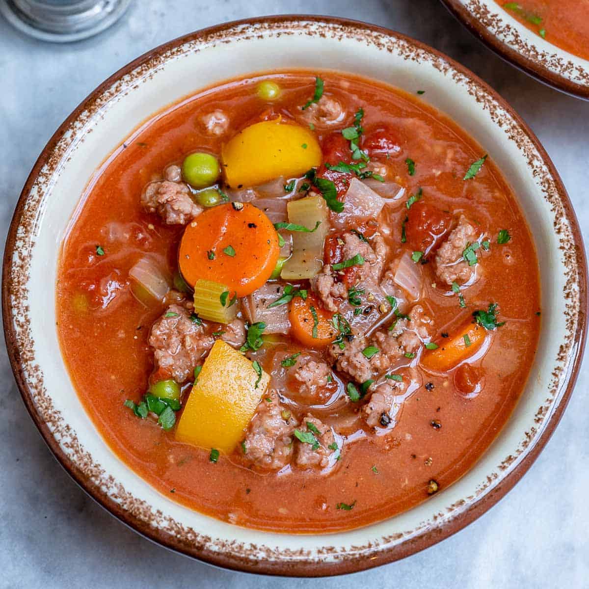 A round bowl with hamburger soup.