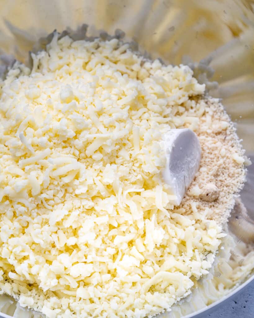 almond flour, cream cheese, and mozzarella cheese added in a mixing bowl