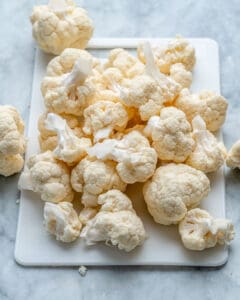 cut up cauliflower on cutting board