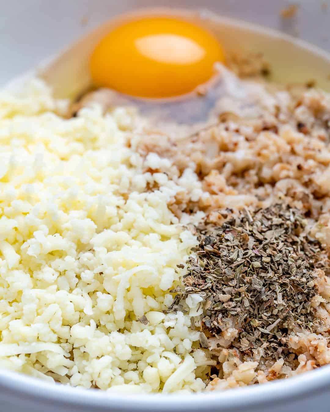 Mix cauliflower rice with egg and seasonings.