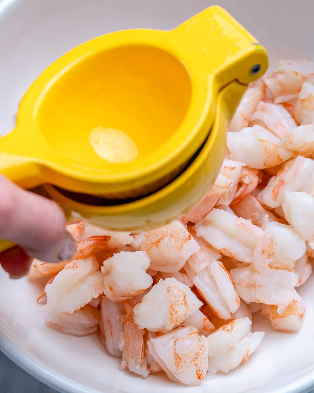 shrimp and lime dressing in a bowl.