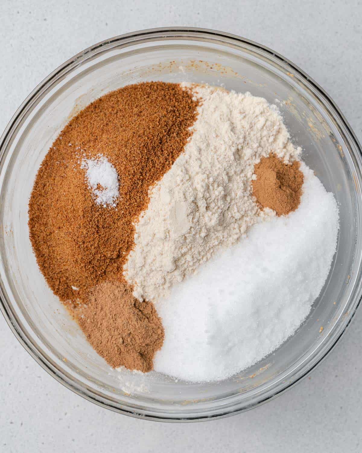 flour, sugar, spices, added in a bowl.