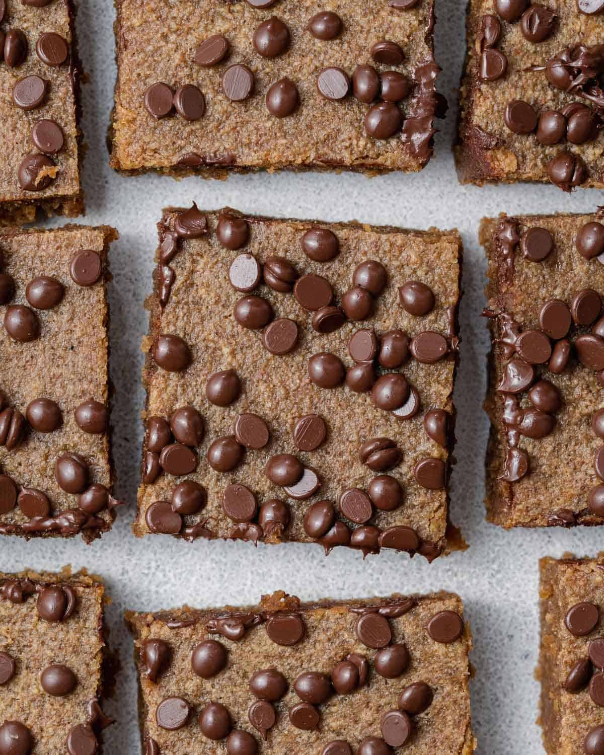 pumpkin bars cut into squares topped with chocolate chips.