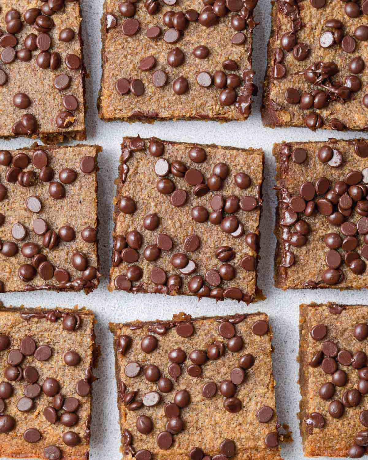 pumpkin bars cut into squares topped with chocolate chips.