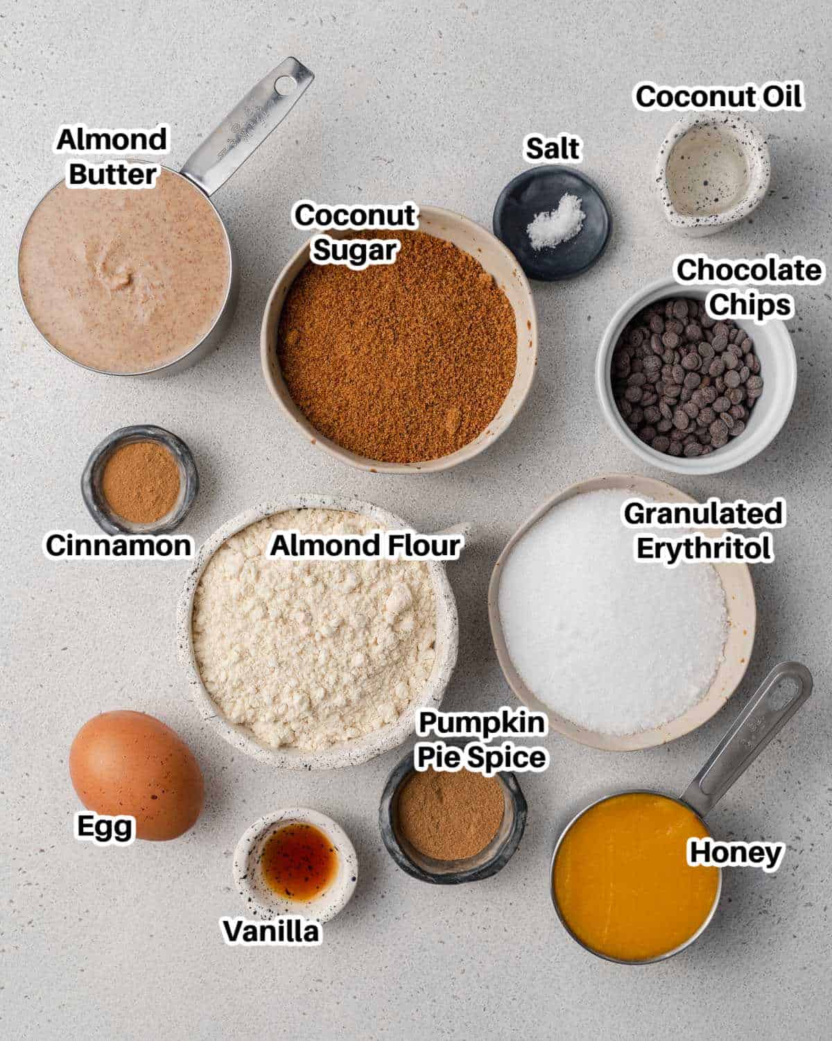 ingredients laid out in small bowls to make pumpkin bars.