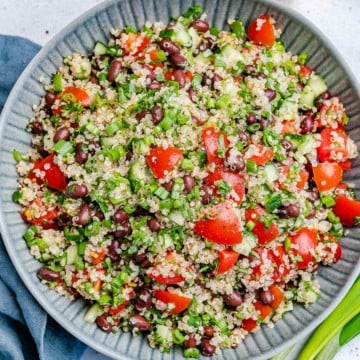 top view black bean tabbouleh salad in a round blue plate