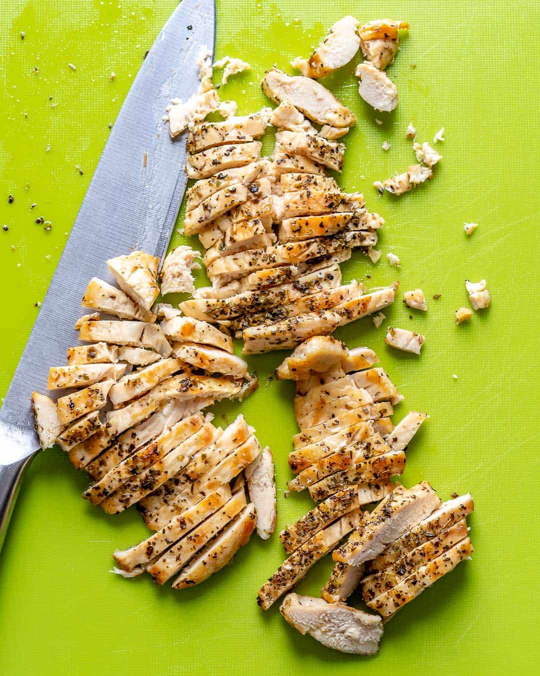 chicken sliced for salad on a cutting board