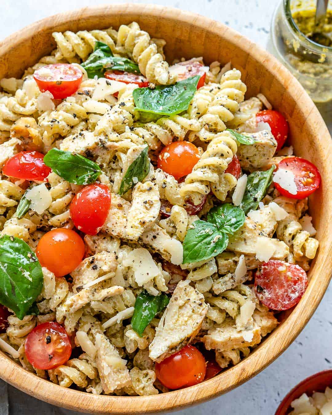 pasta salad in bowl with chicken and fresh cherry tomatoes 