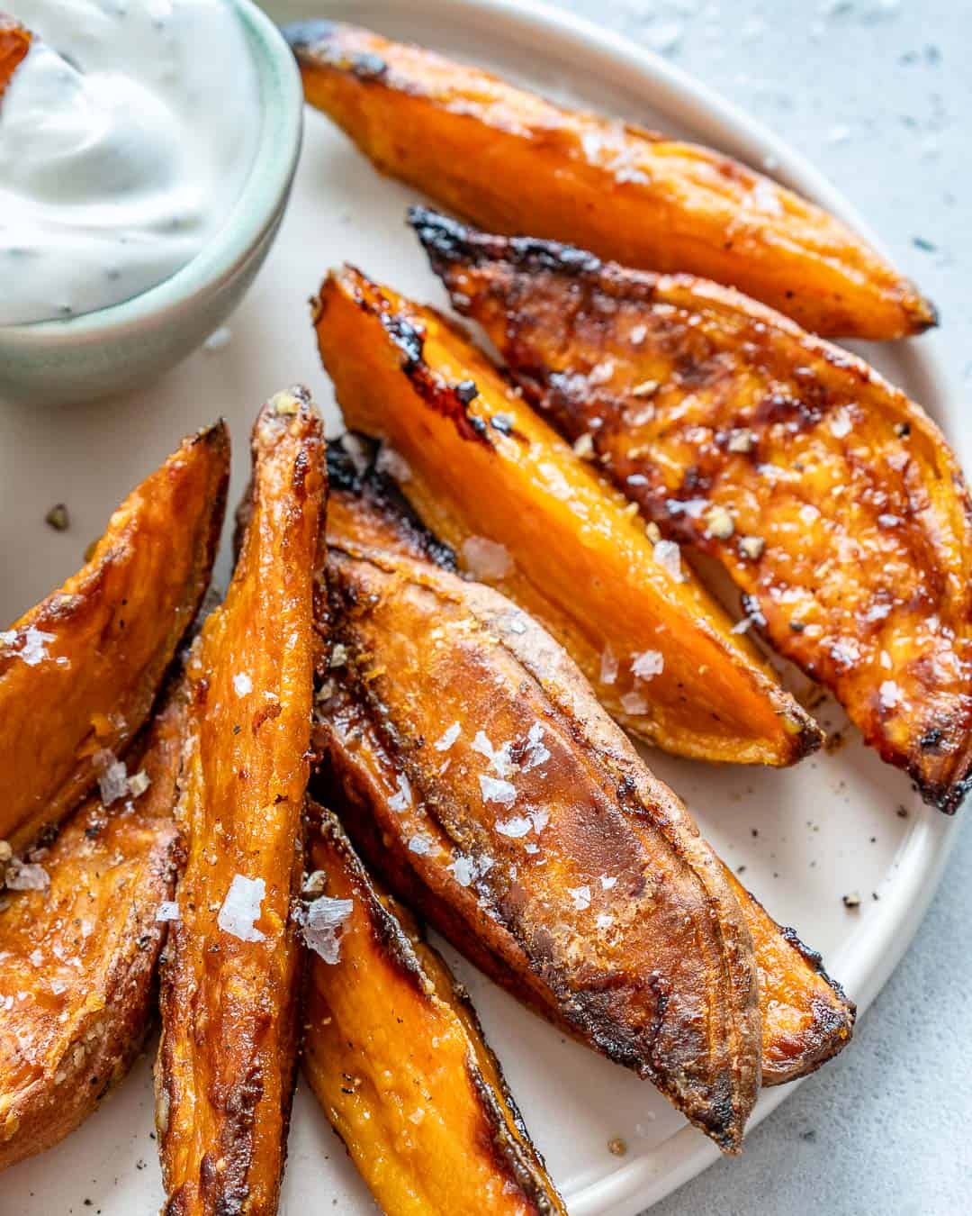 side and closeup view of roasted sweet potato wedges 