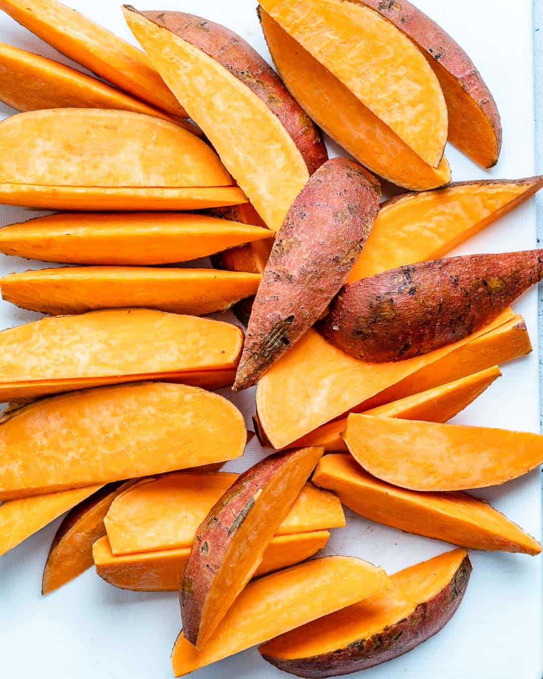 cut up sweet potato wedges on a platter 