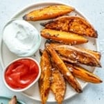 top view of baked sweet potato with ketchup and ranch dips
