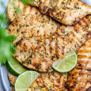 grilled chicken breasts on platter