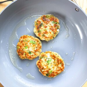 patties being cooked in a pan.