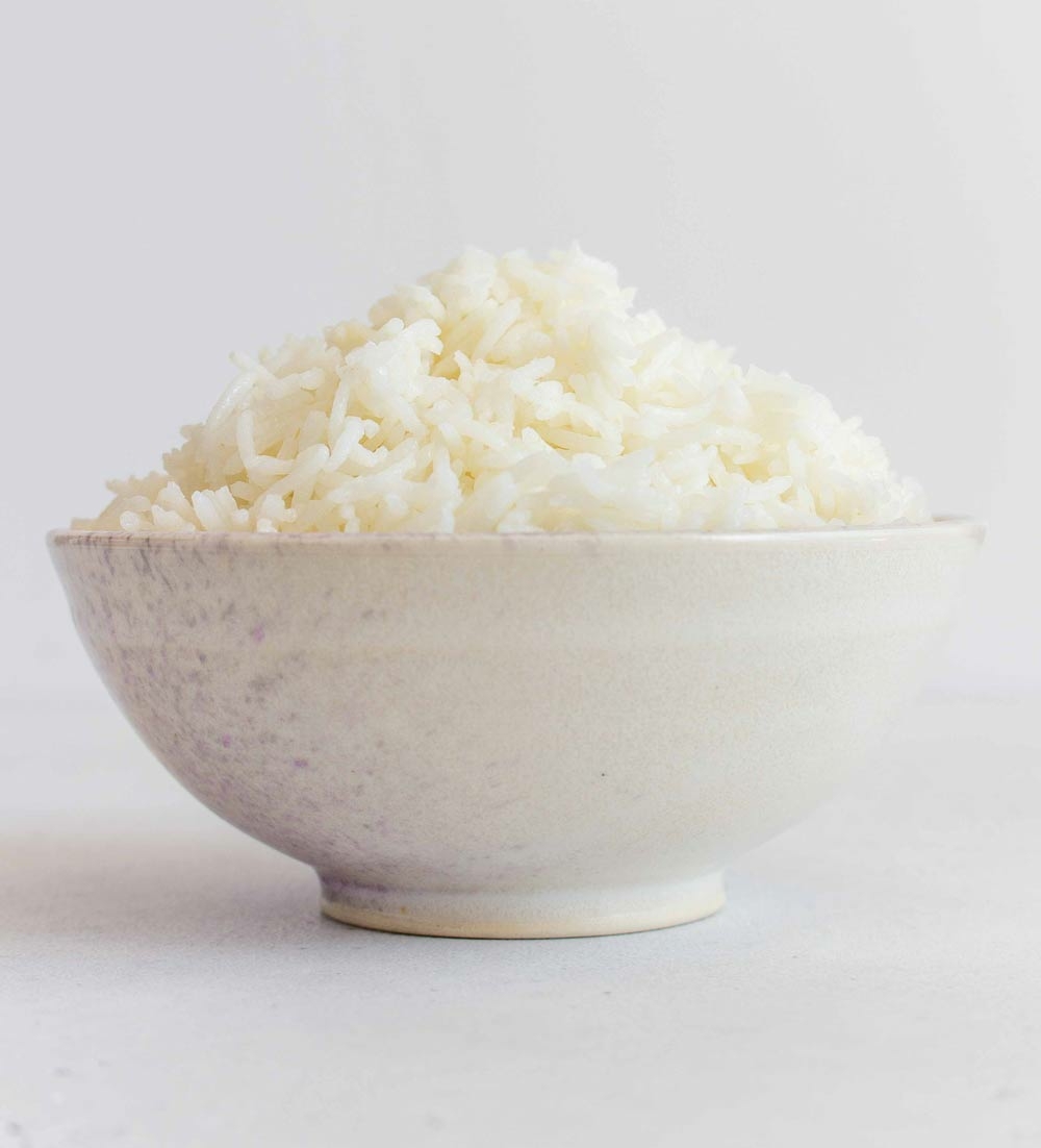 side view of cooked rice in a bowl