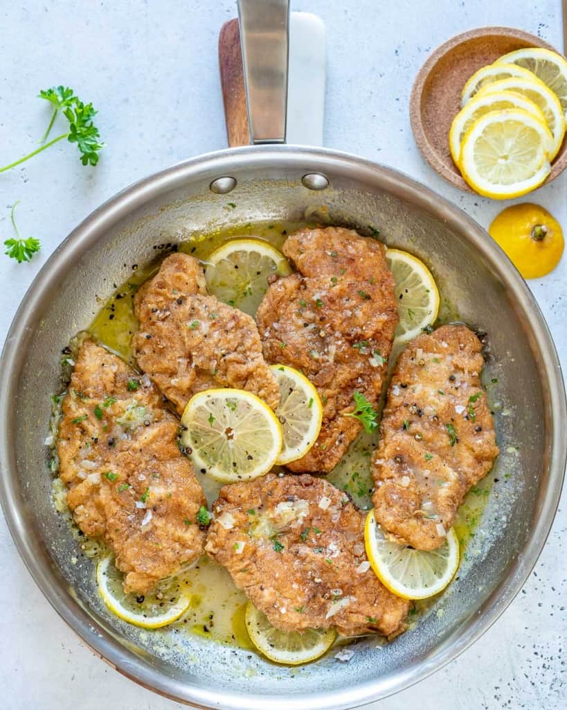 pan with chicken cutlets in a lemon sauce 