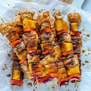 top view of chicken kabobs on a parchment paper