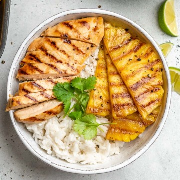 top view grilled chicken and pineapple served over rice