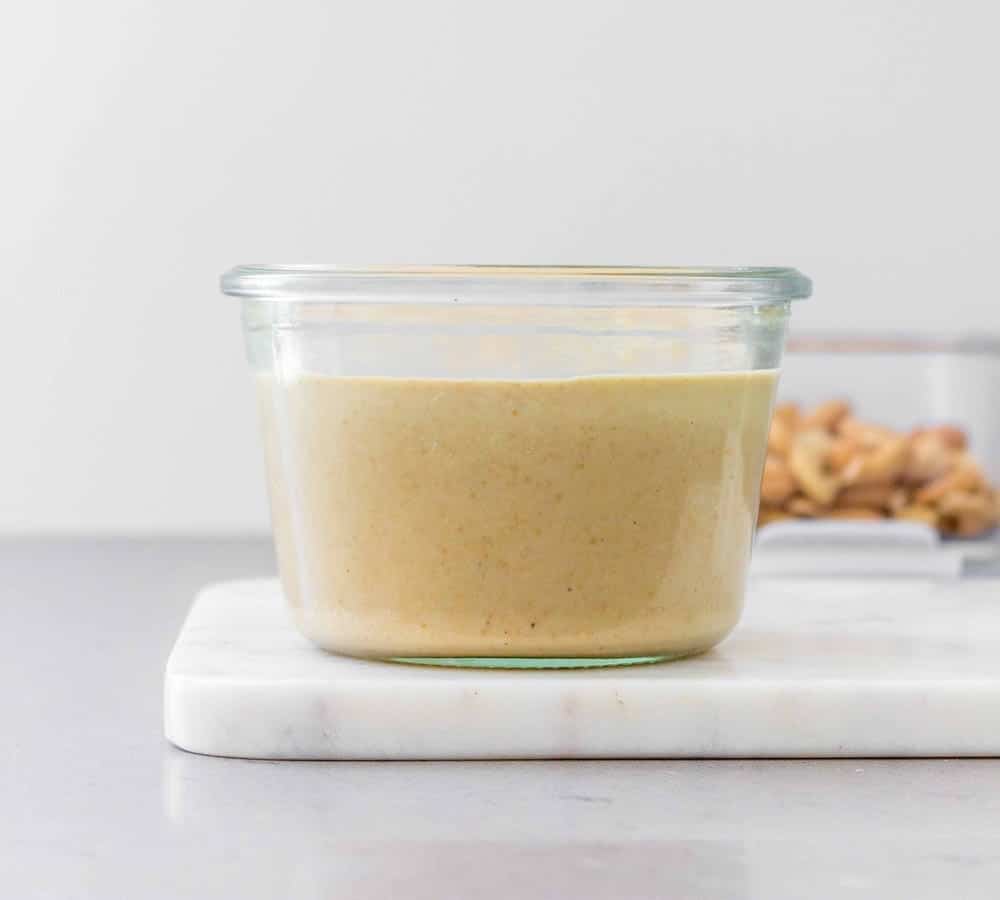 side view of cashew butter in a jar