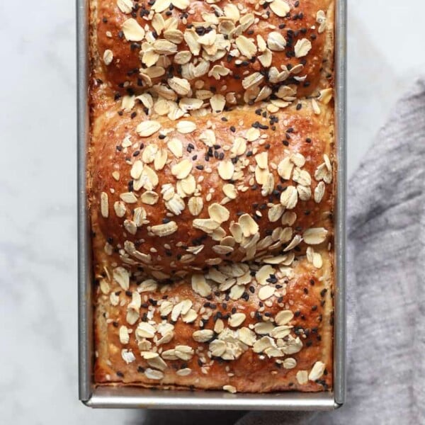 baked wheat bread in a loaf pan.