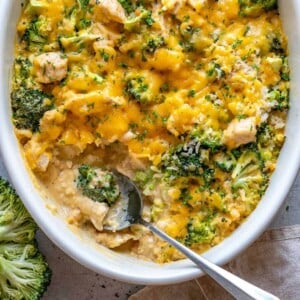 cheesy chicken casserole with spoon in it