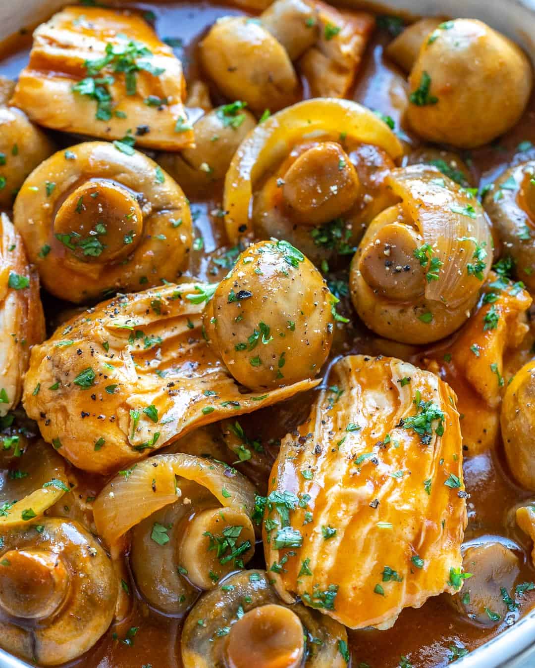 Very close up of chicken and mushrooms.