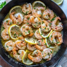 top view of sauteed shrimp in a black skillet