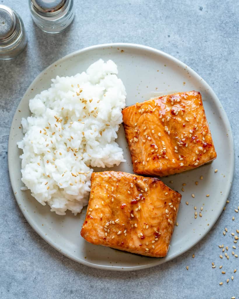 top view of air fried salmon with rice on a plate 