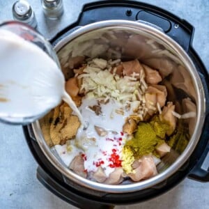 Pouring coconut milk into Instant Pot.