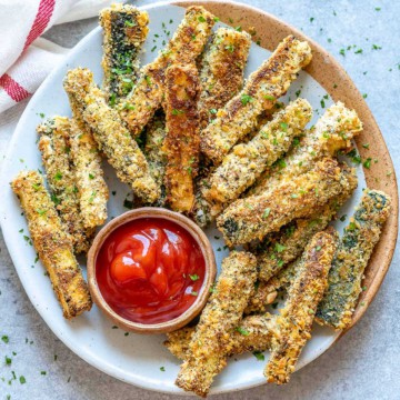 top view of baked zucchini fries with a serving of ketchup