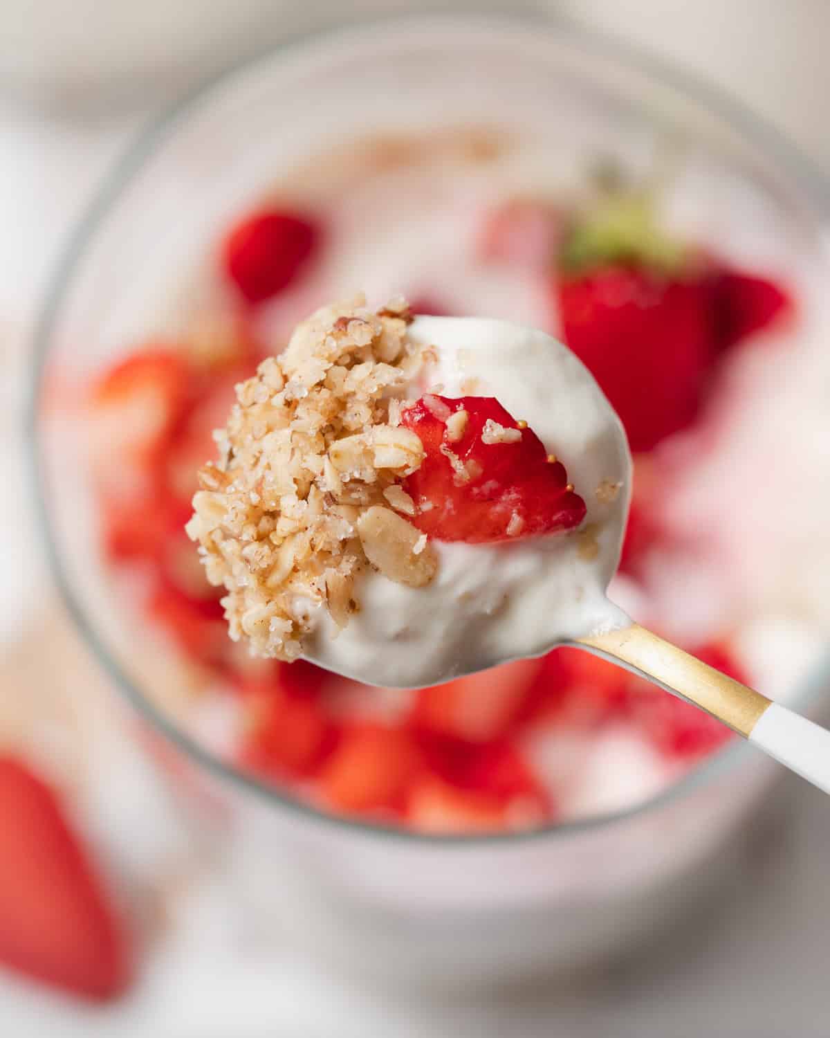 spoonful of no-bake cheesecake from a cup.