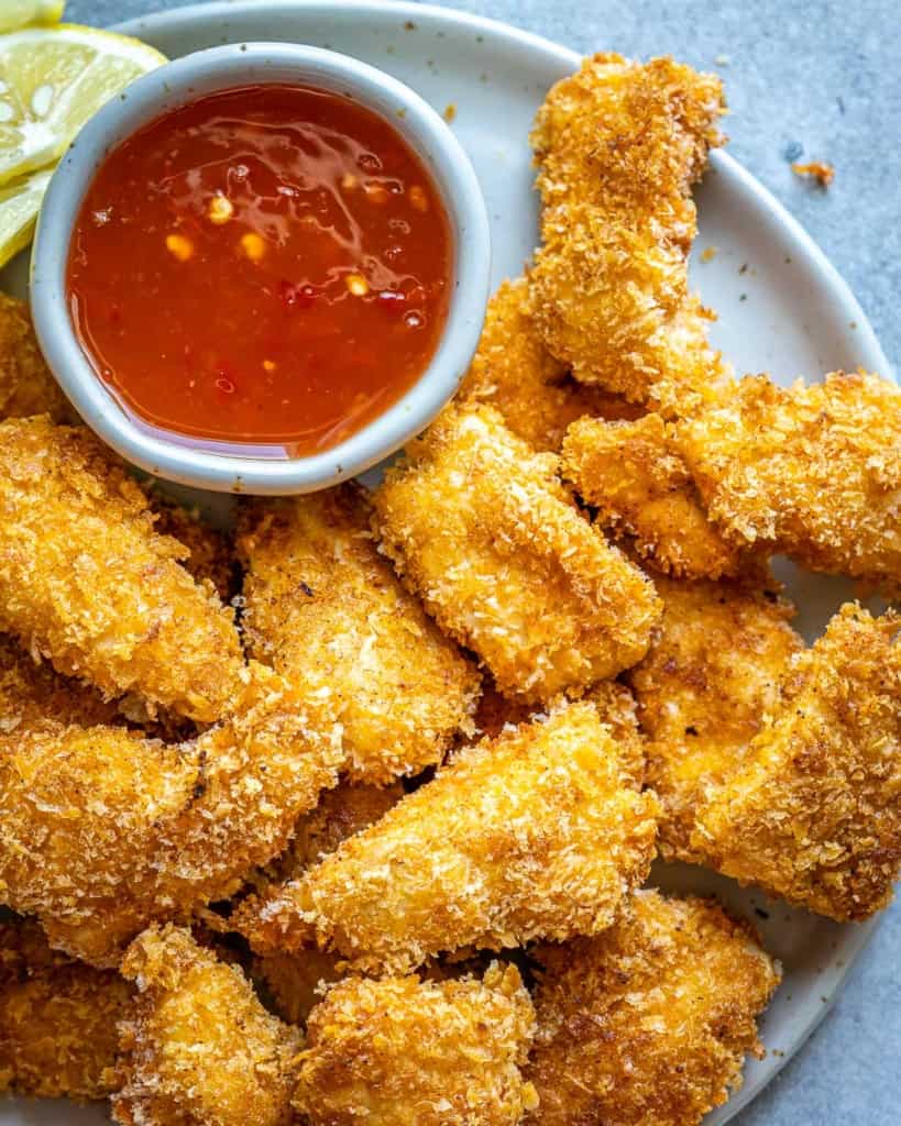 healthy chicken nuggets on a white plate 