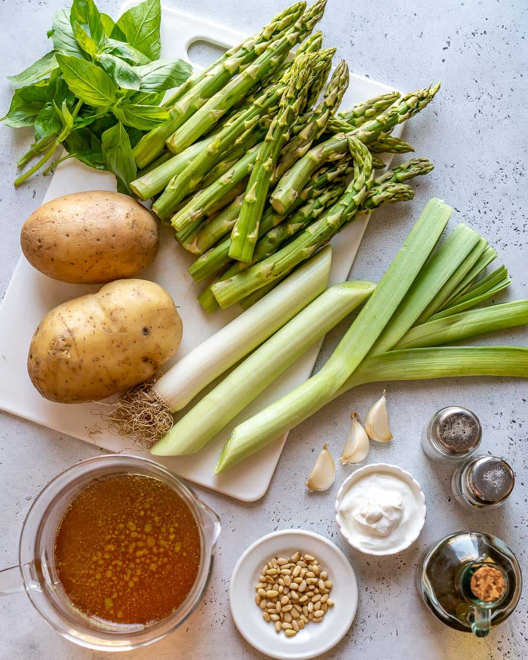 Ingredients for healthy asparagus soup recipe on the counter