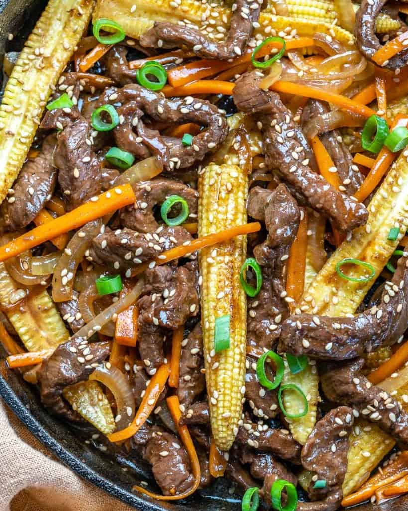 top view stir fry with beef, carrots and corn