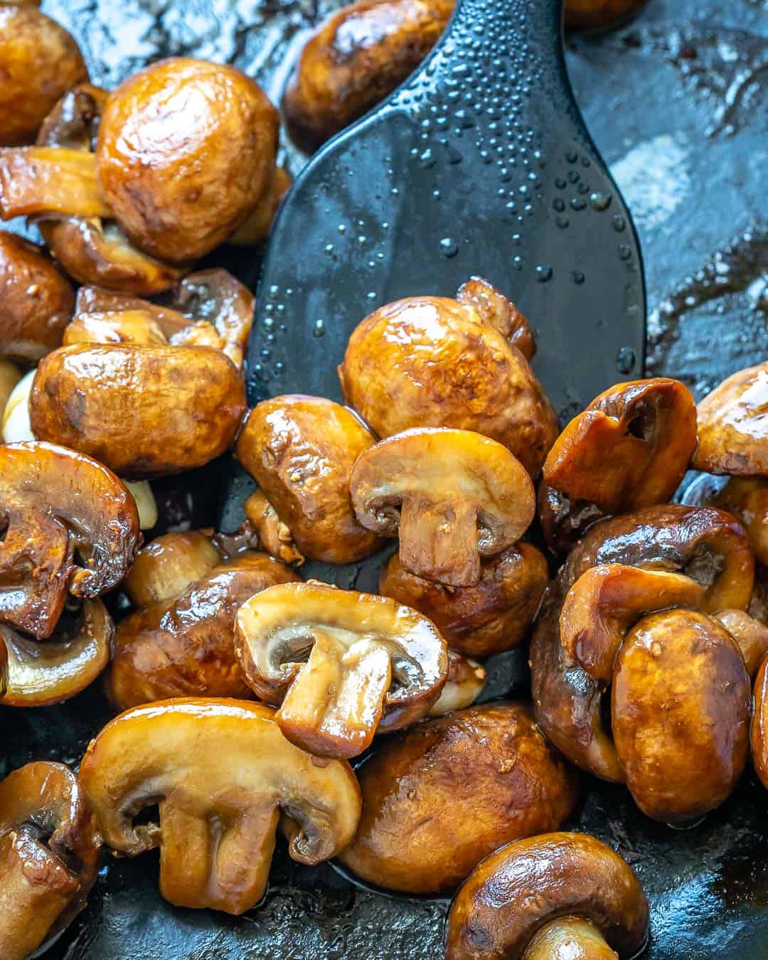 Cooked sliced mushroom in a skillet.