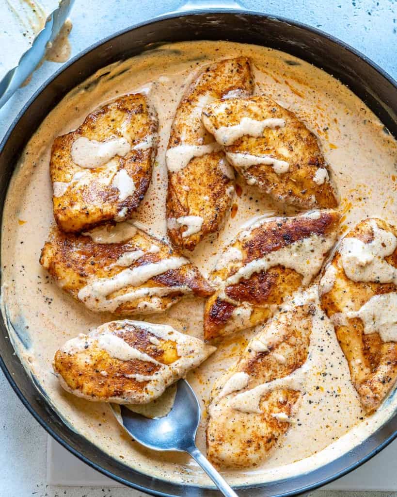 top view creamy cajun chicken in skillet