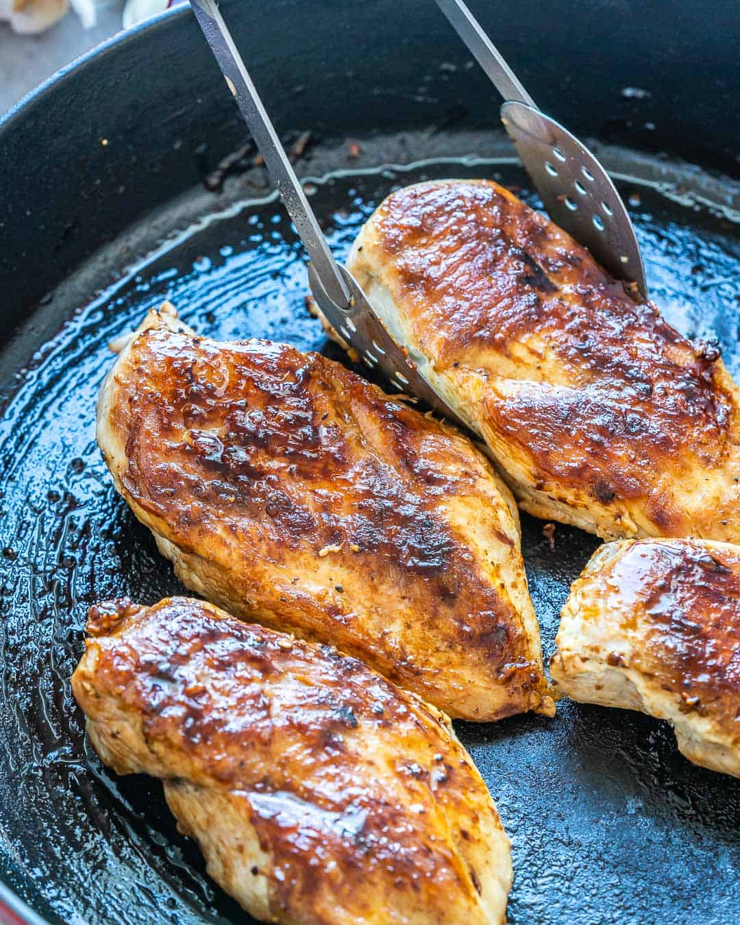 cooked chicken breast on a skillet