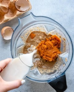 pancake ingredients being added in the blender